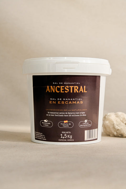 Bucket of ancestral spring salt in flakes
